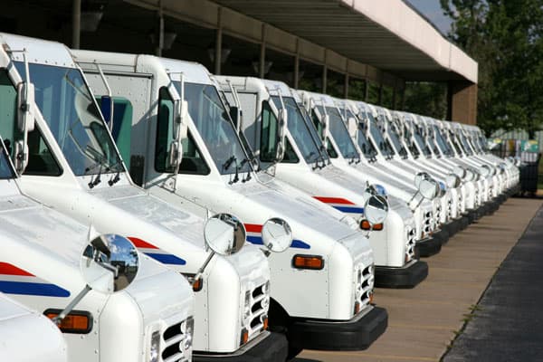 row of federal government postal vehicle